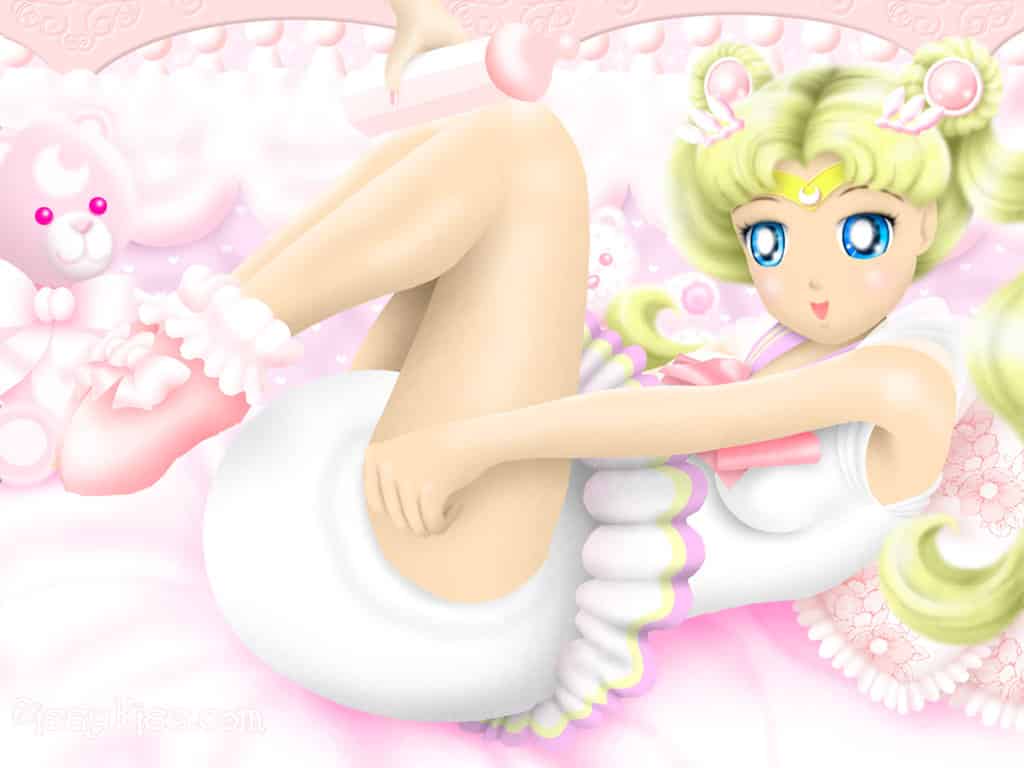 Sissy Baby Girl is in the picture, and she is wearing diapers and sitting on the bed. She looks cute and lovely.
